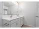 Bright bathroom featuring a double vanity with white countertop and modern fixtures at 11635 W Beck Ave, Youngtown, AZ 85363