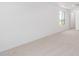 Bright bedroom featuring neutral carpet, white walls, and a window offering natural light at 11635 W Beck Ave, Youngtown, AZ 85363