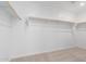 Walk-in closet showcasing ample storage space with a standard rod and shelf at 11635 W Beck Ave, Youngtown, AZ 85363