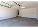 Spacious garage with an automatic door and plenty of room for vehicles and storage at 11635 W Beck Ave, Youngtown, AZ 85363