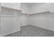 Walk-in closet with carpet and shelving at 12022 W Marguerite Ave, Avondale, AZ 85323