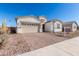 Charming single-Gathering home featuring brick and stucco exterior, and brick paver driveway at 12022 W Marguerite Ave, Avondale, AZ 85323
