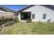 Large backyard featuring a covered patio, mature landscaping and ample room for outdoor activities and entertaining at 13001 W Aster Dr, El Mirage, AZ 85335