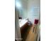 Bright bathroom featuring a single sink, and unique animal print rugs and toilet seat cover at 13001 W Aster Dr, El Mirage, AZ 85335