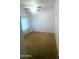 Bedroom with neutral carpet, a large window, and a calming atmosphere at 13001 W Aster Dr, El Mirage, AZ 85335