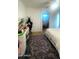 Well-lit bedroom featuring a makeup vanity, area rug, and a neutral color scheme at 13001 W Aster Dr, El Mirage, AZ 85335
