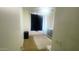 Bedroom with neutral carpet, a large window, and a calming atmosphere at 13001 W Aster Dr, El Mirage, AZ 85335