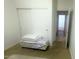 Bedroom with a sliding door closet and a view of an adjacent room at 13001 W Aster Dr, El Mirage, AZ 85335