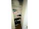 Storage closet with multiple shelves, perfect for organizing personal items at 13001 W Aster Dr, El Mirage, AZ 85335