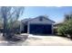 Charming single-story home featuring a two-car garage, desert landscaping, and a welcoming entrance at 13001 W Aster Dr, El Mirage, AZ 85335