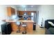 Functional kitchen with wood cabinets and stainless steel appliances at 13001 W Aster Dr, El Mirage, AZ 85335