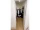 Spacious walk-in closet featuring tile flooring and custom shelving at 13001 W Aster Dr, El Mirage, AZ 85335
