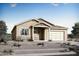 Charming single-story home with stone accents and a well-manicured front yard in a desirable community at 13444 W Claret Cup Rd, Peoria, AZ 85383