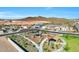 Aerial view of a park area featuring shaded play structures and desert landscaping at 13448 W Auburn Dr, Peoria, AZ 85383