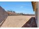 Spacious backyard with dirt landscaping, block fencing, and hillside views at 13448 W Auburn Dr, Peoria, AZ 85383