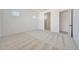 Bright bedroom featuring neutral carpet, white walls, and natural light from two awning windows at 13448 W Auburn Dr, Peoria, AZ 85383