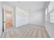 Bright bedroom with double closets, neutral carpet, white walls, and abundant natural light at 13448 W Auburn Dr, Peoria, AZ 85383