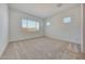 This bedroom features carpet floors, two windows and lots of natural light at 13448 W Auburn Dr, Peoria, AZ 85383
