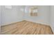 This light and bright bedroom has wood-style tile floors, a large window, and lots of natural light at 13448 W Auburn Dr, Peoria, AZ 85383