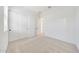 Bright bedroom with double closets, white trim, neutral carpet, and white walls at 13448 W Auburn Dr, Peoria, AZ 85383