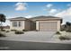 Beautiful single-story home with neutral stucco, a two-car garage, and desert landscaping at 13448 W Auburn Dr, Peoria, AZ 85383
