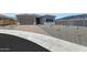 Charming single-story home with a two-car garage, neutral stucco, desert rock landscaping and paver driveway at 13448 W Auburn Dr, Peoria, AZ 85383