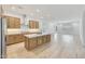 Open-concept kitchen showcasing a center island, modern cabinets and stainless steel appliances at 13448 W Auburn Dr, Peoria, AZ 85383