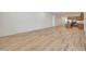 Open-concept living room featuring wood-style tile floors and plenty of space at 13448 W Auburn Dr, Peoria, AZ 85383