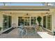 The covered patio features an outdoor seating area, perfect for entertaining or relaxing outdoors at 14111 W Cavalcade Dr, Sun City West, AZ 85375