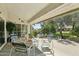 Cozy covered patio with comfortable seating, perfect for enjoying the outdoors in a shaded retreat at 14111 W Cavalcade Dr, Sun City West, AZ 85375