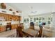 Open concept dining room adjacent to a living area with stylish shelving at 14111 W Cavalcade Dr, Sun City West, AZ 85375