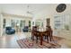 Well-lit dining area featuring tile floors, high ceilings, and large windows at 14111 W Cavalcade Dr, Sun City West, AZ 85375