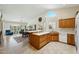 Bright kitchen with a breakfast bar, dining area and open concept living room at 14111 W Cavalcade Dr, Sun City West, AZ 85375