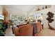 Inviting living room with neutral decor, vaulted ceilings, and an open layout at 14111 W Cavalcade Dr, Sun City West, AZ 85375