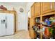 Kitchen pantry features adjustable roll-out shelving for optimal storage and organization at 14111 W Cavalcade Dr, Sun City West, AZ 85375