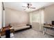 Bedroom with a futon and ceiling fan at 1434 W Meseto Ave, Mesa, AZ 85202