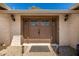 Elegant front door with decorative windows and modern lighting fixtures at 1434 W Meseto Ave, Mesa, AZ 85202