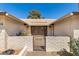 Charming front entrance with a gated courtyard and decorative brickwork at 1434 W Meseto Ave, Mesa, AZ 85202