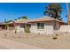 A well maintained single-story home featuring desert landscaping and a warm, inviting exterior at 1434 W Meseto Ave, Mesa, AZ 85202