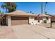 Street view of a well-maintained single-story home with neutral colors and desert landscaping at 1434 W Meseto Ave, Mesa, AZ 85202