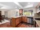 Well-lit kitchen featuring granite countertops and stainless steel appliances at 1434 W Meseto Ave, Mesa, AZ 85202