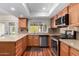 Bright kitchen with stainless steel appliances and granite countertops at 1434 W Meseto Ave, Mesa, AZ 85202
