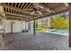 Brick patio with a pool and wood ceiling at 1434 W Meseto Ave, Mesa, AZ 85202