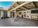 Wide shot of a brick patio featuring a wood ceiling and pillars at 1434 W Meseto Ave, Mesa, AZ 85202