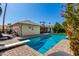 Sparkling pool featuring diving board, chairs, and a covered patio area for relaxation at 1434 W Meseto Ave, Mesa, AZ 85202