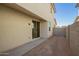 A cozy backyard with a sliding glass door provides access to the home's interior at 15584 S 180Th Ln, Goodyear, AZ 85338