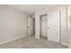 Bedroom featuring a closet with sliding doors, neutral walls, and carpet flooring at 15584 S 180Th Ln, Goodyear, AZ 85338