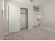 Bedroom featuring a closet with sliding doors, neutral walls, and carpet flooring at 15584 S 180Th Ln, Goodyear, AZ 85338