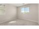 Bedroom with neutral walls, carpet flooring, and lots of natural light from two windows at 15584 S 180Th Ln, Goodyear, AZ 85338