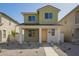 Charming two-story home featuring a welcoming front porch and low-maintenance landscaping at 15584 S 180Th Ln, Goodyear, AZ 85338